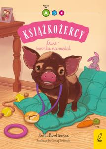 Lulu - świnka na medal. Książkożercy. Poziom A. Autor: Paszkiewicz Anna. Multiszop.pl Okładka książki Lulu - świnka na medal. Książkożercy. Poziom A