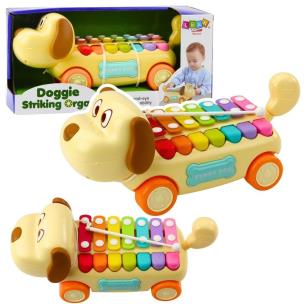 Piesek jeżdżący z cymbałkami. Wydawca: Leantoys. Multiszop.pl Opakowanie Piesek jeżdżący z cymbałkami